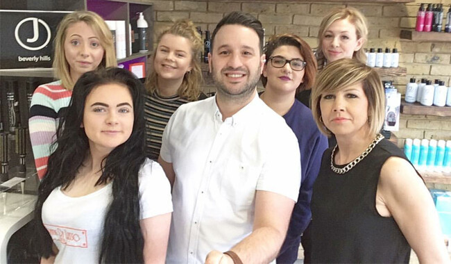 Hairdressing salon owner Frank Di Lusso with his hairdressing assistants.